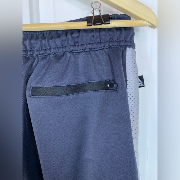 Reebok Dark Gray Stretchy Soft Track Pants. 3 pockets.  Zippers at leg base. - Picture 9 of 13